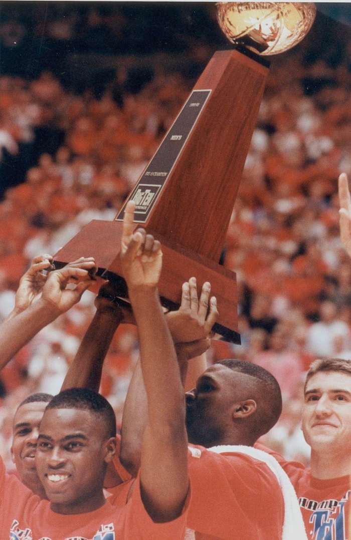 Indiana seniors Greg Graham, Chris Reynolds, Calbert Cheaney and Matt Nover raise the Big 10 trophy March 11, 1993.